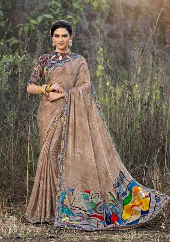 Simple And Elegant Looking Printed Saree Is Here In Beige Color Paired With Multi Colored Blouse. As It IS fabricated On Satin Georgette, It Is Light Weight And Easy To Carry All Day Long. 