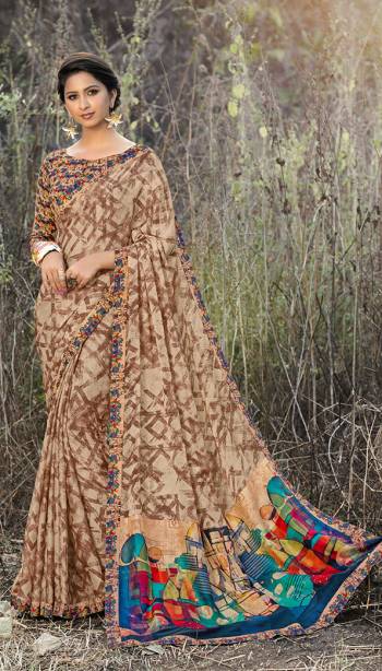 Simple And Elegant Looking Printed Saree Is Here In Light Brown Color Paired With Multi Colored Blouse. As It IS fabricated On Satin Georgette, It Is Light Weight And Easy To Carry All Day Long. 