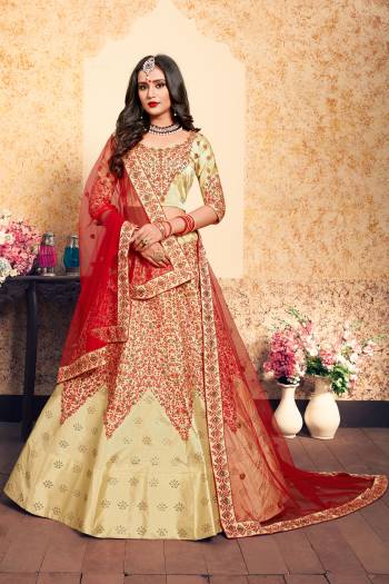 For A Royal Look, Grab This Rich Color Pallet Heavy Designer Lehenga Choli In Cream Color Paired With Contrasting Red Colored Dupatta. This Lehenga Choli Is Satin Based Paired With Net Fabricated Dupatta. Both The Fabrics Ensures Superb Comfort Throughout The Gala.