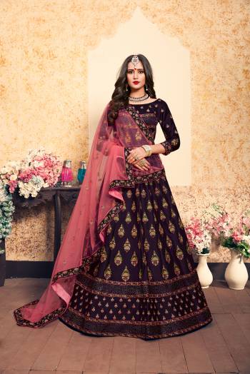 Dark Colors Gives A More Pretty Look To Your Personality, So Grab This Heavy designer Lehenga Choli In Dark Purple Color Paired With Contrasting Pink Colored Dupatta, This Lehenga Choli Is Fabricated On Satin Paired With Net Fabricated Dupatta. It Has Very Pretty Contrasting Embroidery All Over It.