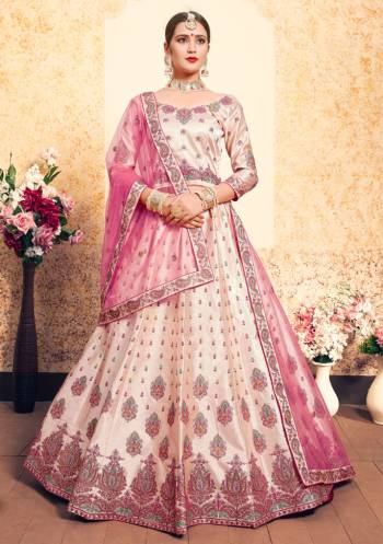 Flaunt Your Rich And Elegant Taste Wearing This Heavy Designer Lehenga Choli In Light Peach Color Paired With Contrasting Pink Colored Dupatta. This Lehenga Choli Is Fabricated On Satin Paired With Net Fabricated Dupatta. It Has Pretty Resham Embroidery With Stone Work. Buy Now.