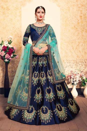 Bright And Visually Appealing Color IS Here With This Heavy Designer Lehenga Choli In Royal Blue Color Paired With Contrasting Aqua Blue Colored Dupatta. This Pretty Lehenga Choli Satin Based Paired With Net fabricated Dupatta. Buy This Lehenga Choli Now.