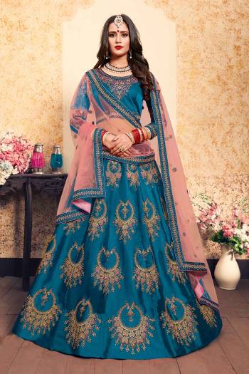 Bright And Visually Appealing Color IS Here With This Heavy Designer Lehenga Choli In Blue Color Paired With Contrasting Pink Colored Dupatta. This Pretty Lehenga Choli Satin Based Paired With Net fabricated Dupatta. Buy This Lehenga Choli Now.