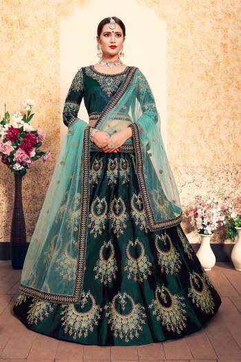 Bright And Visually Appealing Color IS Here With This Heavy Designer Lehenga Choli In Teal Green Color Paired With Contrasting Light Blue Colored Dupatta. This Pretty Lehenga Choli Satin Based Paired With Net fabricated Dupatta. Buy This Lehenga Choli Now.