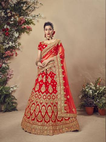 Get Ready For Your Big Day With This Heavy Designer Lehenga Choli In Red Color. This Heavy Embroidered Lehenga Choli Is Fabricated On Velvet Paired With Net Fabricated Dupatta. It Is Beautified With Heavy Jari Embroidery and Stone Work. Buy Now. 