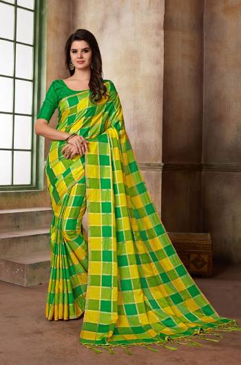 Grab This Beautiful Checks Printed Saree In Yellow And Green Color Paired With Green Colored Blouse. This Saree And Blouse Are Silk based Which Also Gives A Rich Look To Your Personality. 