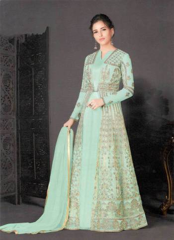 Add This Very Pretty Designer Indo-Western Suit to Your Wardrobe For The Upcoming Festive And Wedding Season. Its Top And Dupatta Are Net Based Which Comes With A Same Colored Silk Based Inner. It Is Beautified With Heavy Embroidery Making It More Attractive. 