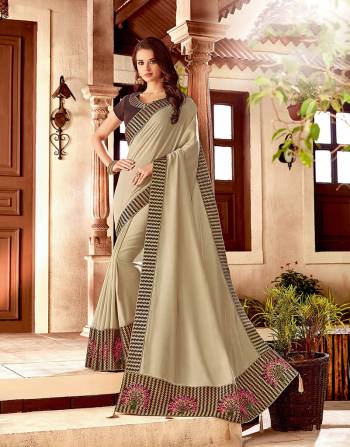 Ace the heritage fashion in an utmost straightforward manner in this Cream and brown embroidered saree. Add simple jewels and keep the look minimal.