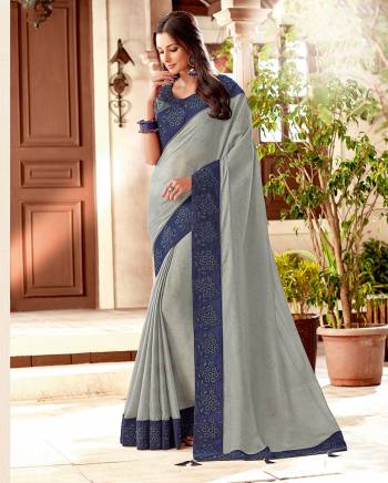 Exude an understated appeal in this subtle grey saree. Pair with statement jhumkis to complete the look. 