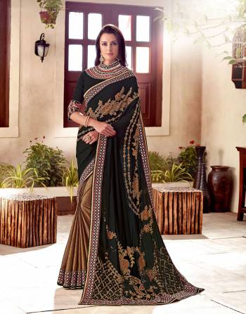 Black, gold and red makes for a timeless combination. Look classically modern in this heavily embellished saree. 