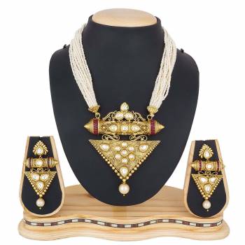 For A Queen Look, Here Is A Designer Royal Looking Necklace Set In Golden Color. This Necklace Set Can Be Paired With Heavy Ethnic Attire For More Enhanced Look. Buy Now.