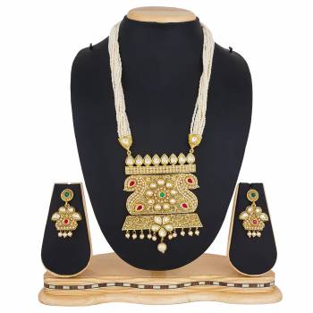 For A Queen Look, Here Is A Designer Royal Looking Necklace Set In Golden Color. This Necklace Set Can Be Paired With Heavy Ethnic Attire For More Enhanced Look. Buy Now.