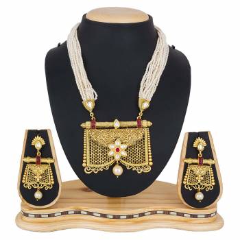 For A Queen Look, Here Is A Designer Royal Looking Necklace Set In Golden Color. This Necklace Set Can Be Paired With Heavy Ethnic Attire For More Enhanced Look. Buy Now.