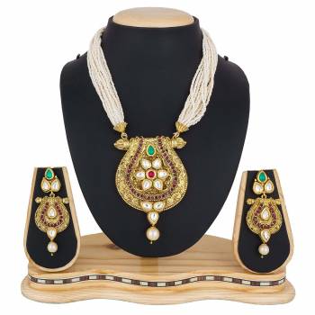 For A Queen Look, Here Is A Designer Royal Looking Necklace Set In Golden Color. This Necklace Set Can Be Paired With Heavy Ethnic Attire For More Enhanced Look. Buy Now.