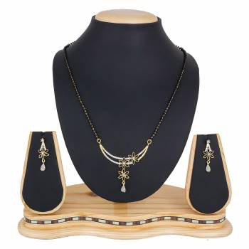 Give An Elegant Look To Your Neckline With This Pretty Set Of Mangalsutra Which Comes With A Pair Of Earrings. Pair This Up With Color And Any Type Of Attire. 