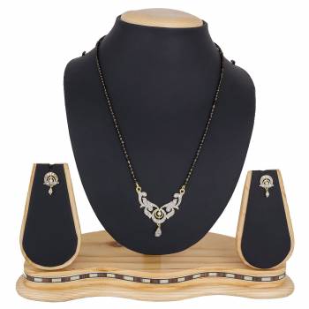 Give An Elegant Look To Your Neckline With This Pretty Set Of Mangalsutra Which Comes With A Pair Of Earrings. Pair This Up With Color And Any Type Of Attire. 