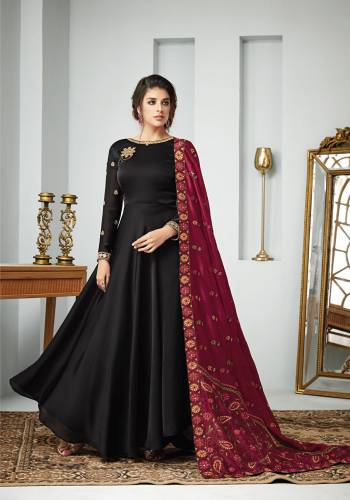 For A Bold And Beautiful Look, Grab This Designer Floor Length Suit In Black Color paired with Maroon Colored Dupatta. Its Top Is Fabricated On Satin Georgette Paired With Santoon Bottom And Art Silk Dupatta. All Its Fabric Are Soft Towards Skin And Ensures Superb Comfort All Day Long. 