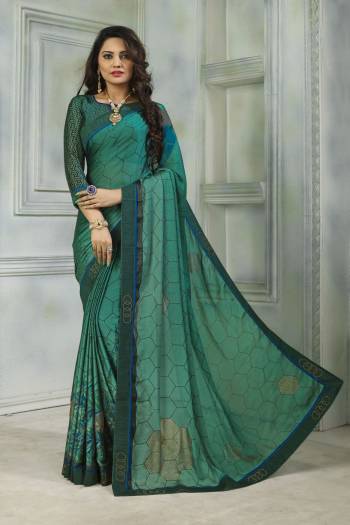 Here Is A Saree For Your Semi-Casual Or Festive Wear. This Lovely Saree And Blouse Are Fabricated On Satin Chiffon Beautified With Prints And Stone Work. Also It Is Light Weight And Soft Towards Skin Which Ensures Superb Comfort all Day Long. 