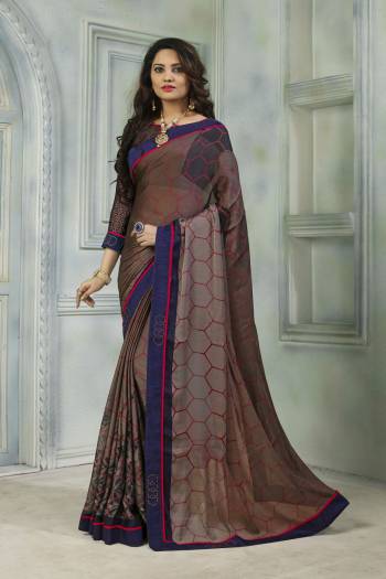 Add This Very Pretty Saree To Your Wardrobe For The Upcoming Festive Season. This Saree And Blouse Are Fabricated On Satin Chiffon Beautified With Prints And Stone Work. Buy Now.