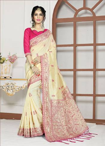 Simple And Elegant Looking Designer Saree In Here In Cream Color Paired With Rani Pink Colored Blouse. This Saree And Blouse Are Fabricated On Art Silk Beautified With Attractive Embroidery. Buy Now.