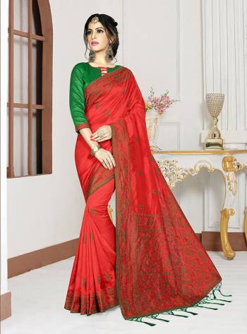 Add This Pretty Bright Shade To Your Wardrobe With This Designer Saree In Crimson Red Color Paired With Contrasting Green Colored Blouse. This Saree And Blouse Are Fabricated On Art Silk Which Also Gives A Rich Look To Your Personality. 