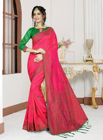 Shine Bright In This Very Pretty Rani Pink Colored Saree Paired With Contrasting Green Colored Blouse. This Saree And Blouse Are Silk Based Beautified With Embroidery. 