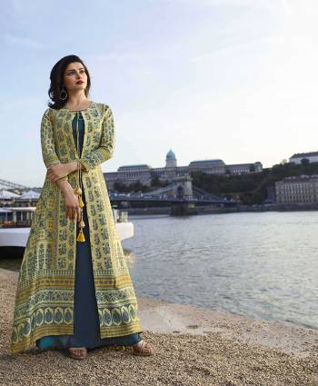 Elegant And Rich Looking Designer Readymade Kurti Is Here In Light Yellow And Blue Color. It Is Silk Based With Subtle Color Pallete. Buy Now.