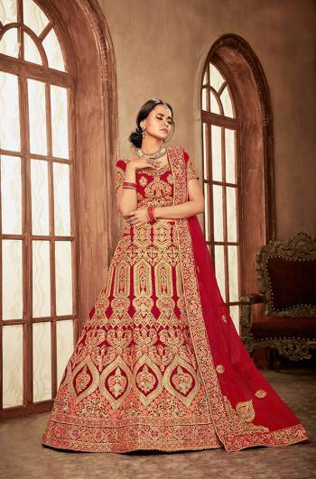 Here Is A Perfect Bridal Look For You With This Heavy designer Lehenga Choli In Red Color. This Lehenga Choli Is Velvet Based Paired With Net Fabricated Dupatta.Its Fabric Also Ensures Superb Comfort Throughout The Gala