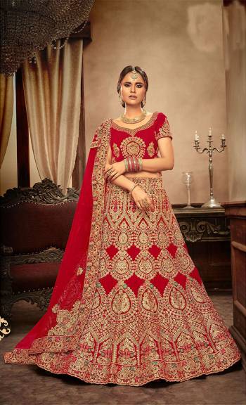 Get Ready For Your Big Day With This Heavy Designer Lehenga Choli In Red Color. This Heavy Embroidered Lehenga Choli Is Fabricated On Velvet Paired With Net Fabricated Dupatta. It Is Beautified With Heavy Jari & Thread Embroidery and Stone Work. Buy Now