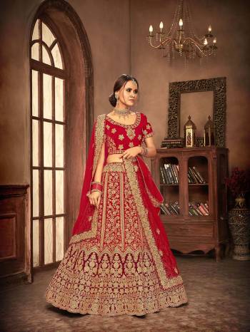 Here Is A Perfect Bridal Look For You With This Heavy designer Lehenga Choli In Red Color. This Lehenga Choli Is Velvet Based Paired With Net Fabricated Dupatta.Its Fabric Also Ensures Superb Comfort Throughout The Gala