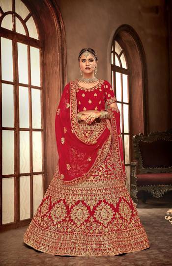 Get Ready For Your Big Day With This Heavy Designer Lehenga Choli In Red Color. This Heavy Embroidered Lehenga Choli Is Fabricated On Velvet Paired With Net Fabricated Dupatta. It Is Beautified With Heavy Jari & Thread Embroidery and Stone Work. Buy Now