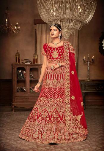 Get Ready For Your Big Day With This Heavy Designer Lehenga Choli In Red Color. This Heavy Embroidered Lehenga Choli Is Fabricated On Velvet Paired With Net Fabricated Dupatta. It Is Beautified With Heavy Jari & Thread Embroidery and Stone Work. Buy Now