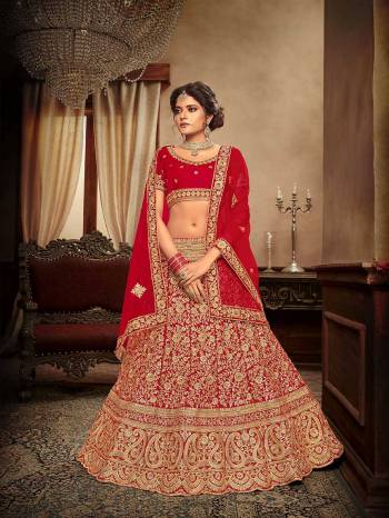 Get Ready For Your Big Day With This Heavy Designer Lehenga Choli In Red Color. This Heavy Embroidered Lehenga Choli Is Fabricated On Velvet Paired With Net Fabricated Dupatta. It Is Beautified With Heavy Jari & Thread Embroidery and Stone Work. Buy Now