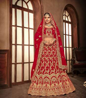 Here Is A Perfect Bridal Look For You With This Heavy designer Lehenga Choli In Red Color. This Lehenga Choli Is Velvet Based Paired With Net Fabricated Dupatta.Its Fabric Also Ensures Superb Comfort Throughout The Gala