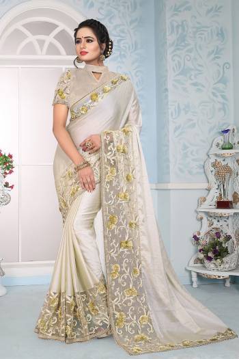 Simple And Elegant Looking Designer Saree Is Here In Off-White Color Paired With Off-White Colored Blouse. This Saree Is Fabricated On Satin Silk Paired With Art Silk Fabricated Blouse. It Has Very Pretty Fancy Embroidery Making The Saree Attractive. 