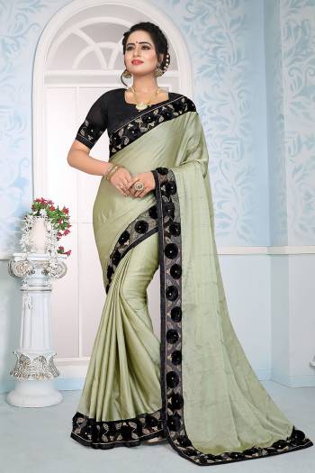 Flaunt Your Rich And Elegant Look Wearing This Designer Saree In Pastel Green Color Paired With Black Colored Blouse. This Saree Is Fabricated On Satin Silk Paired With Art Silk Fabricated Blouse. It Has Fancy 3D Flower With Coding Embroidery. 