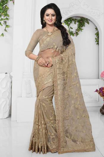 Rich And Elegant Looking Designer Saree Is Here With Heavy Embroidery All Over. This Saree And Blouse Are Fabricated On Net Which Is Light In Weight And Also Easy To Carry Throughout The Gala.