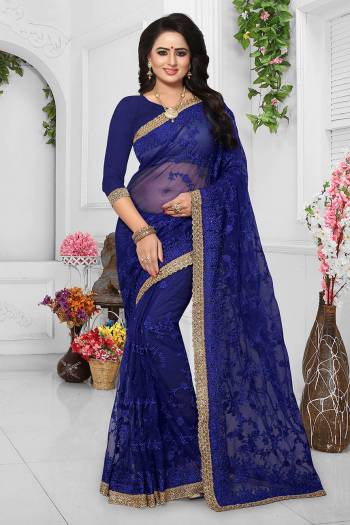 Grab This Heavy Designer Saree For The Upcoming Wedding Season. This Beautiful Heavy Embroidered Saree And Blouse Are Fabricated On Net Beautified With Resham Embroidery And Stone Work. Pair It Up Minimal Elegant Accessories. 