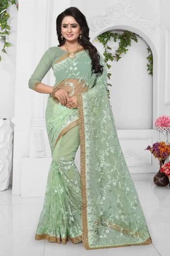 Rich And Elegant Looking Designer Saree Is Here With Heavy Embroidery All Over. This Saree And Blouse Are Fabricated On Net Which Is Light In Weight And Also Easy To Carry Throughout The Gala.