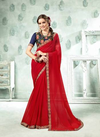 Adorn A Pretty Angelic Look In This Beautiful Designer Saree In Red Color Paired With Contrasting Navy Blue Colored Blouse. This Saree Is Fabricated On Georgette Paired With Art Silk Fabricated Blouse. Buy Now.