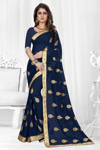 Grab This Designer Georgette Based Saree With Georgette Fabricated Blouse, It Is Beautified With Jari Embroidered Butti Work And Lace Border. Buy Now.