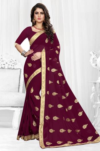 Celebrate This Festive Season Wearing This Rich And Elegant looking Designer Saree Fabricated On Georgette. It Is Beautified with Jari Embroidered Butti All Over It With Lace Border. 