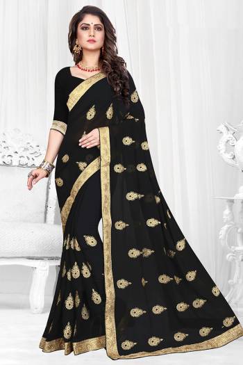 Celebrate This Festive Season Wearing This Rich And Elegant looking Designer Saree Fabricated On Georgette. It Is Beautified with Jari Embroidered Butti All Over It With Lace Border. 