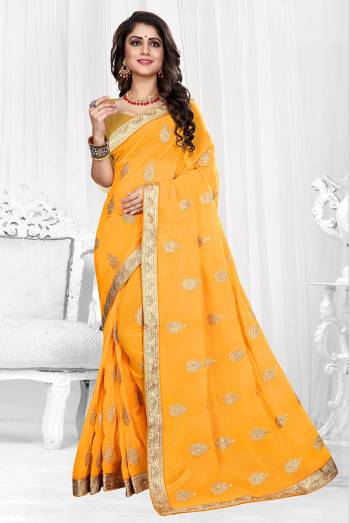 Grab This Designer Georgette Based Saree With Georgette Fabricated Blouse, It Is Beautified With Jari Embroidered Butti Work And Lace Border. Buy Now.