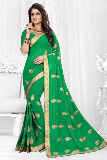 Celebrate This Festive Season Wearing This Rich And Elegant looking Designer Saree Fabricated On Georgette. It Is Beautified with Jari Embroidered Butti All Over It With Lace Border. 