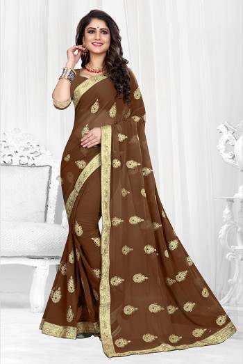 Grab This Designer Georgette Based Saree With Georgette Fabricated Blouse, It Is Beautified With Jari Embroidered Butti Work And Lace Border. Buy Now.