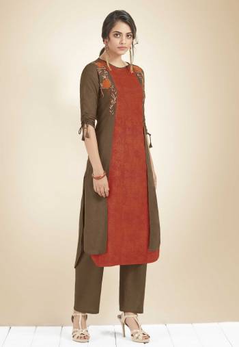 For The Utmost Comfort, Grab This Designer Readymade Kurti In Orange And Brown Color Fabricated On Cotton. It Is Beautified With Thread Work. Also This Kurti Is Available In All Regular Sizes. 