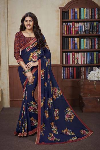 Comfort Comes First When Its About Casuals, Grab This Pretty Light Weight Saree Fabricated On Georgette Beautified With Prints And Lace Border. 