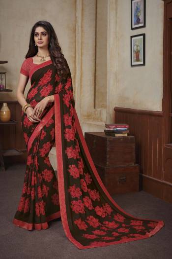 Add This Beautiful Saree To Your Wardrobe For Your Casuals Or Semi-Casual Wear. This Saree And Blouse Are Georgette Based Beautified With Prints And Lace Border All Over. 