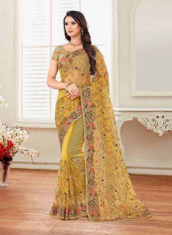 Grab This Heavy Designer Saree For The Upcoming Festive And Wedding Season With This Very Pretty Yellow Colored Saree And Blouse. This Saree And Blouse Are Fabricated On Net Beautified With Heavy Embroidery All Over It. 